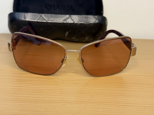 Chanel sunglasses in a dark plum