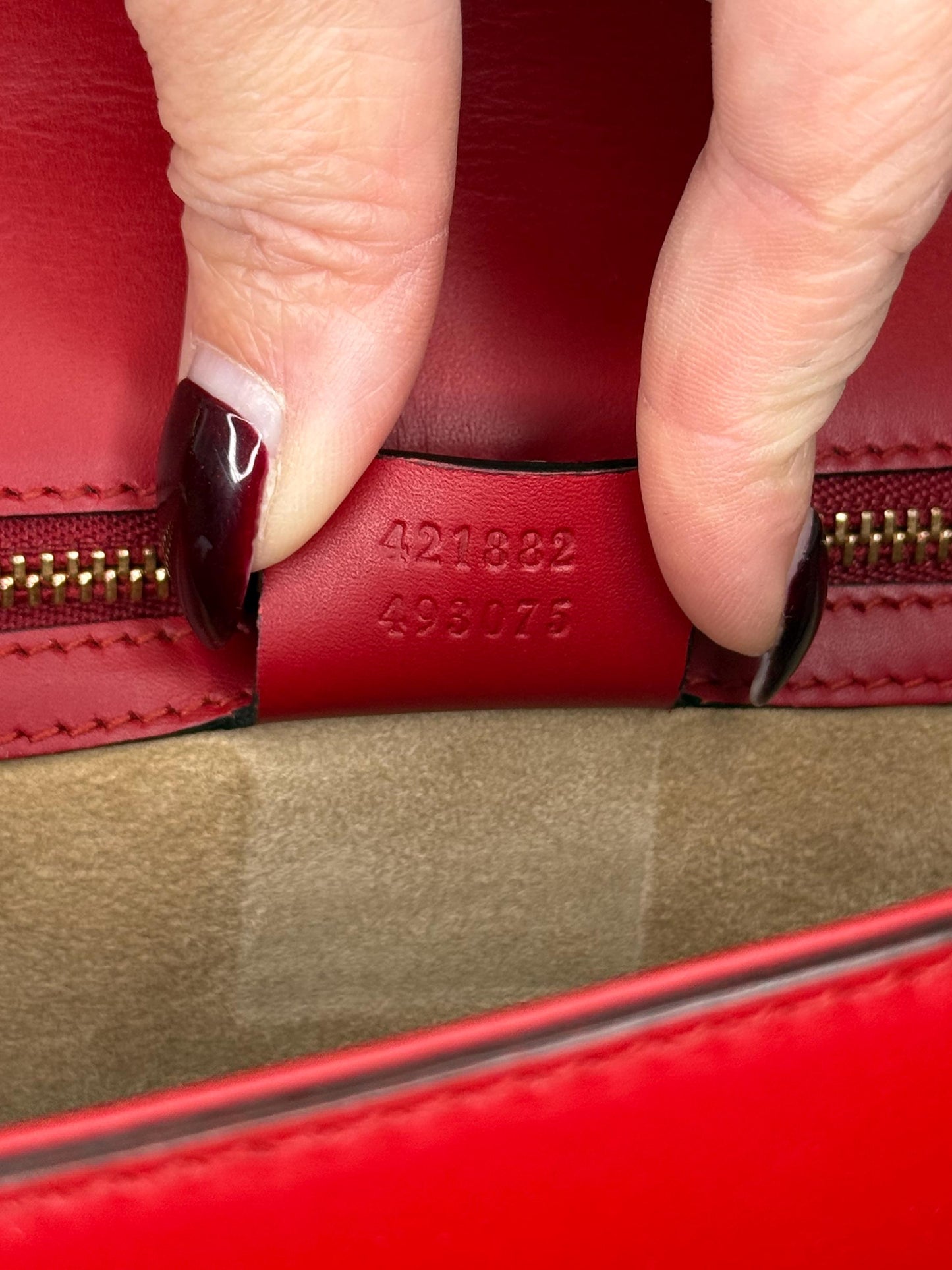 AUTHENTIC Gucci Red Leather Sylvie Sholuder Bag with gold-tone chain and buckle hardware.