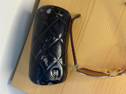 Chanel sunglasses in a dark plum