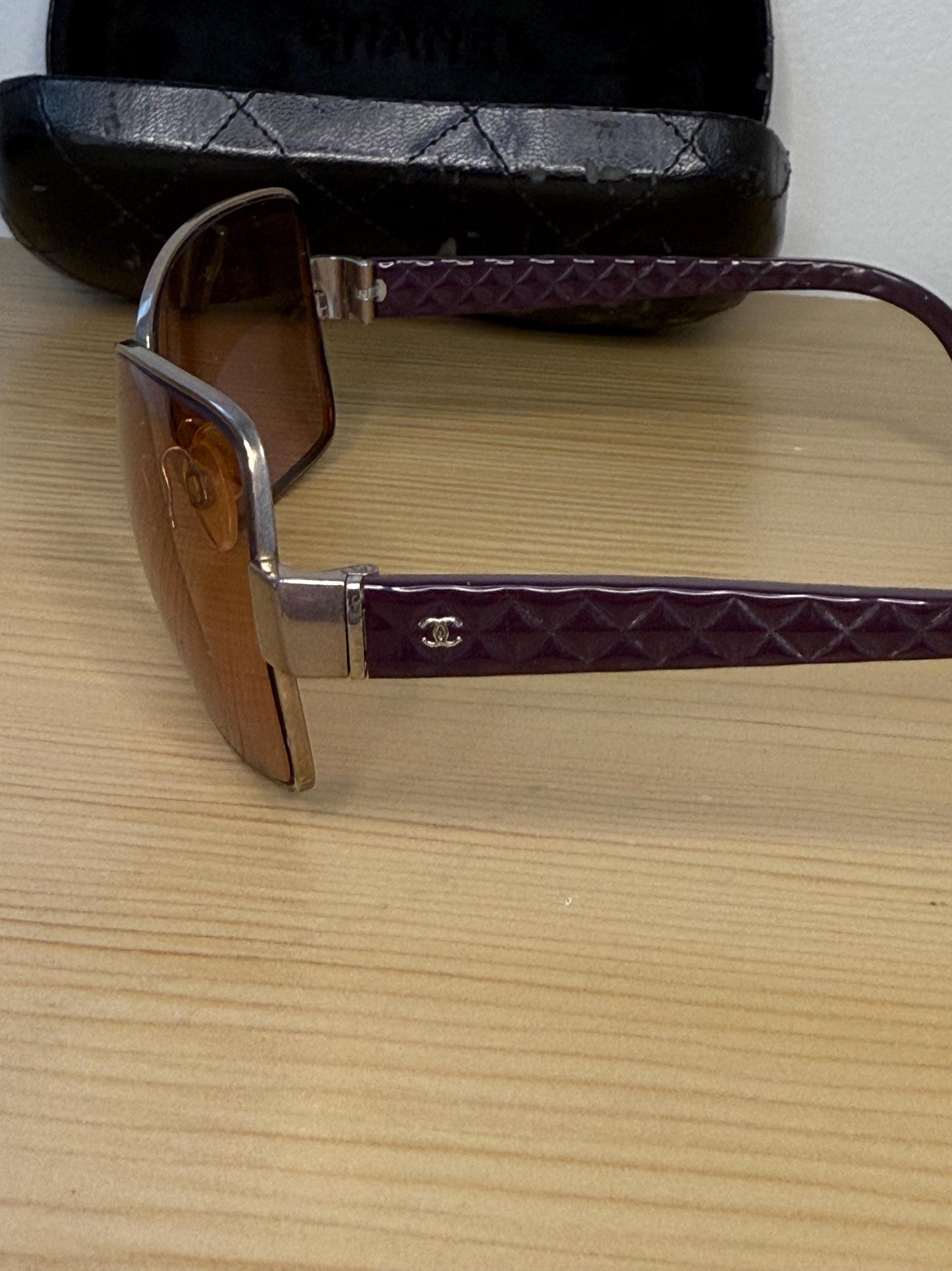 Chanel sunglasses in a dark plum
