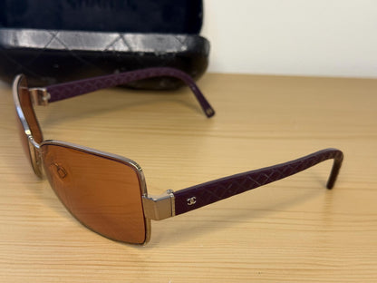 Chanel sunglasses in a dark plum