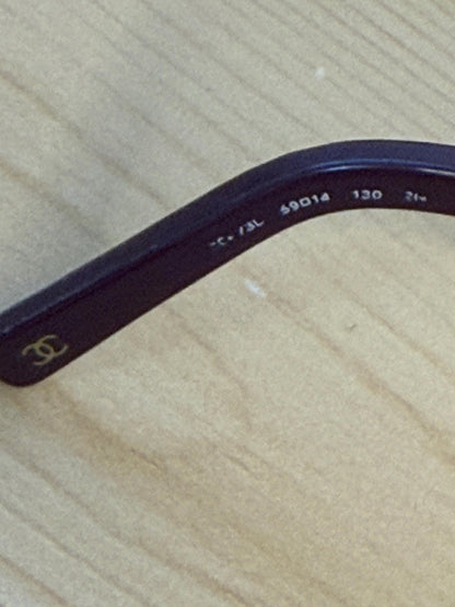 Chanel sunglasses in a dark plum