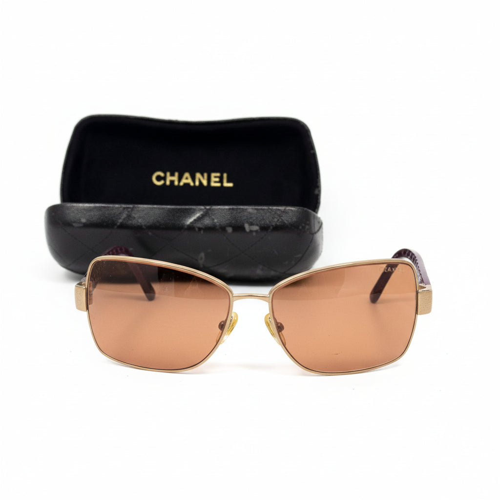 Chanel sunglasses in a dark plum
