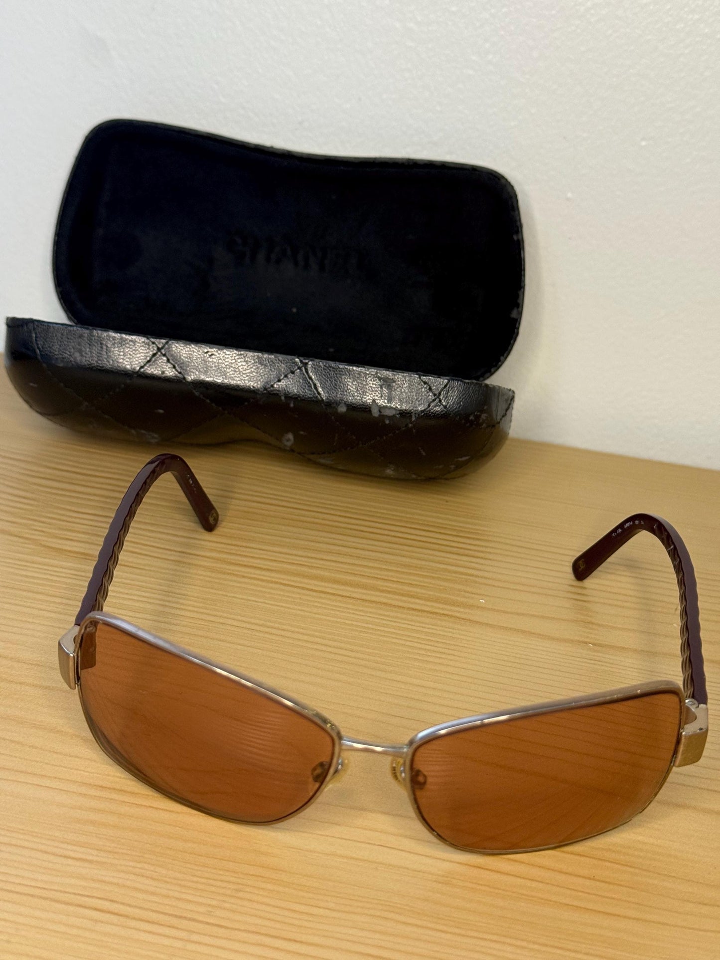 Chanel sunglasses in a dark plum