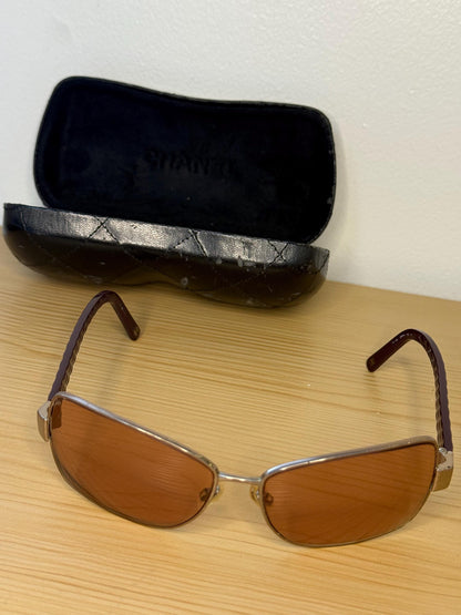 Chanel sunglasses in a dark plum