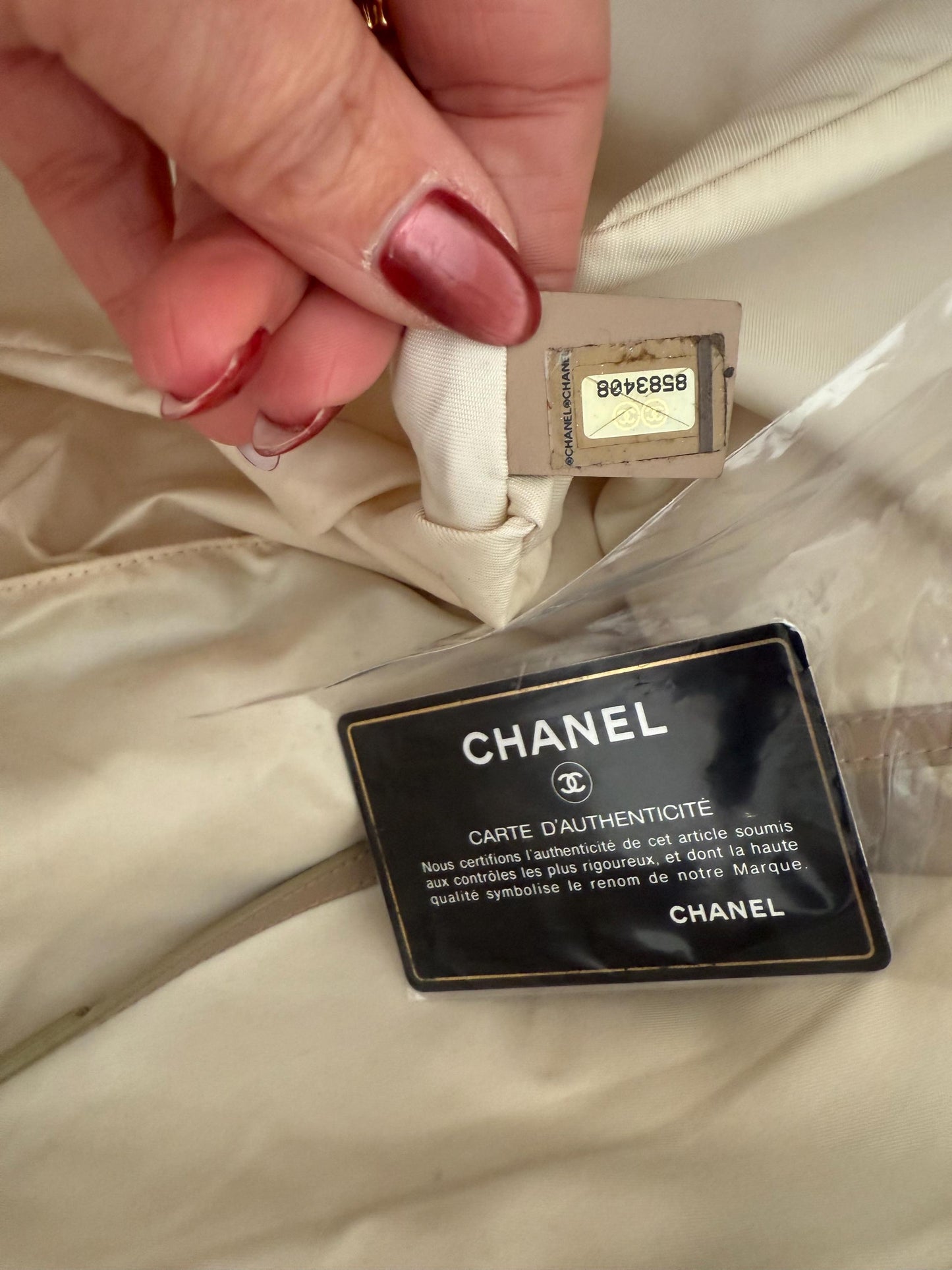 AUTHENTIC Chanel Travel Line tote bag in a blush pink nylon canvas with beige leather trim and straps